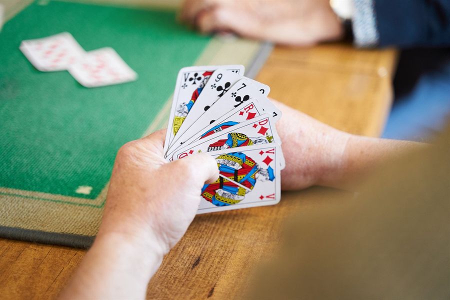 Hand of cards over a green table